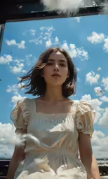 an image of a woman sitting under a blue sky