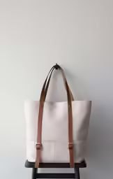 a bag sitting on top of a stool
