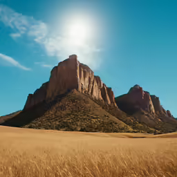 the sun is shining in a desert landscape