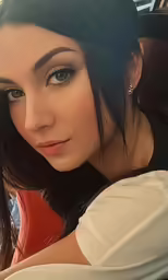 woman with grey eyes looking at the camera