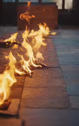 there are many flames on the ground in the street
