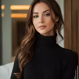 a woman with long brown hair wearing a black turtleneck sweater