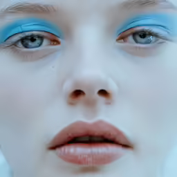 a woman with blue eyes with no make up