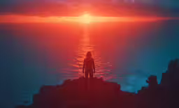 a person standing on top of a hill watching the sun go down
