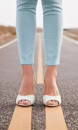 legs of the woman on the road and her shoes