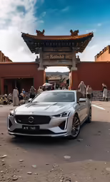 a car is parked in front of the chinese pagoda