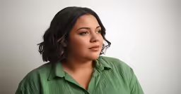 a close up view of a woman looking off into the distance