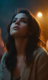 a woman with long hair looking up into the sky