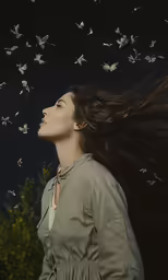 a woman with a bunch of butterfly in her hair
