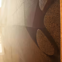 a window and a decorative artwork on a building