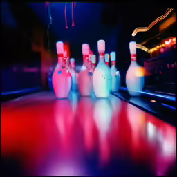 a bowling alley has a bowling pin in front of it