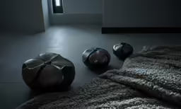 a few stone balls with bows on them