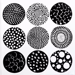 nine circular patterns on white paper,a picture with several circles in the middle