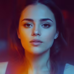 a woman in the foreground with a red light in the background