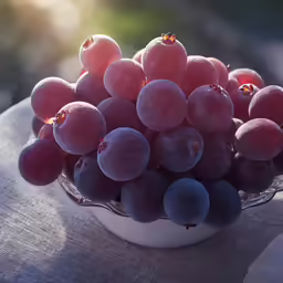a bowl full of fruits sitting on top of a table