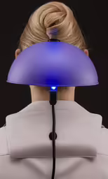 the back of a person with a blue light on their head
