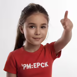 a little girl making a funny face with her finger