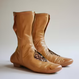 the old, tan shoe has the stitchs and braided design on it