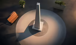 the small statue is in front of the smaller statue