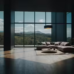 large modern living room with couches overlooking trees