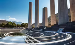the monument in an outdoor cemetery with people walking and looking on
