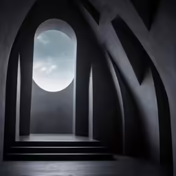 a dark concrete room with arches and stairs