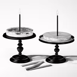 a close up of two cakes with candles