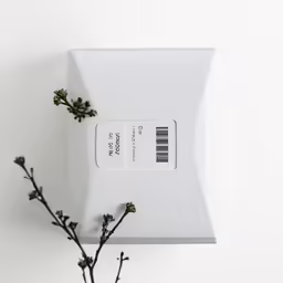 a white container with an id card sitting on top of it