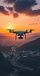 a white airplane flying over a city with a sunset in the background