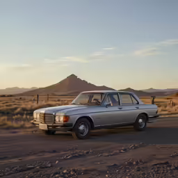 an old car sits in the middle of the desert