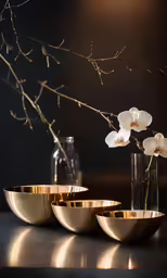 flowers with large vases sitting on counter in indoor setting