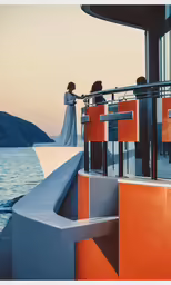 a couple standing on a boat next to water