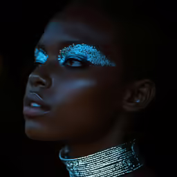 woman with glittery eyes and jewelry posing
