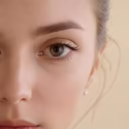a close up of a woman with her eyebrows down