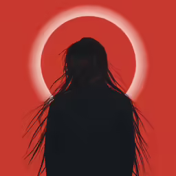the silhouette of a woman in front of a round object