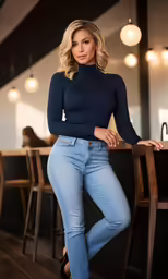 a woman standing in jeans with her hands on her hips