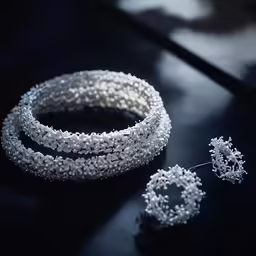 several strands of pearls are all around the jewelry on a table