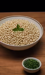 peas and other vegetables are in a white bowl