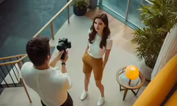 a woman is getting ready to shoot herself