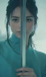 a girl with long hair holding up two sword