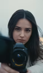 a woman taking a picture with her camera
