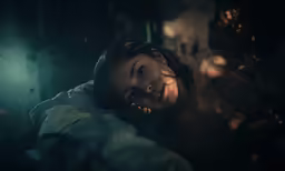 there is a young girl that has a creepy face