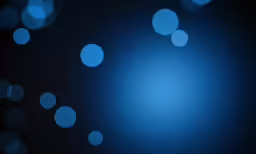 a close up shot of a surface with lots of blue lights