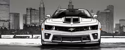 the grille and front grill on a chevrolet camaro zr1,a car parked near a large city on the water