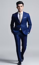 a man in a blue suit poses in the studio