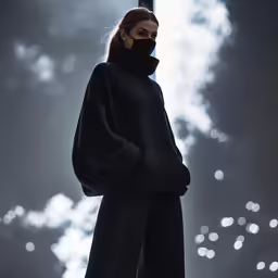 a woman wearing a black outfit standing in the dark