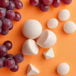 several different kinds of food are laying out on a yellow surface