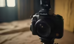 a black digital camera on a tripod