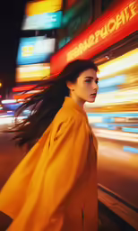 a woman standing on the sidewalk next to traffic