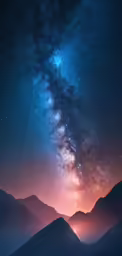 mountains under night sky and stars above them